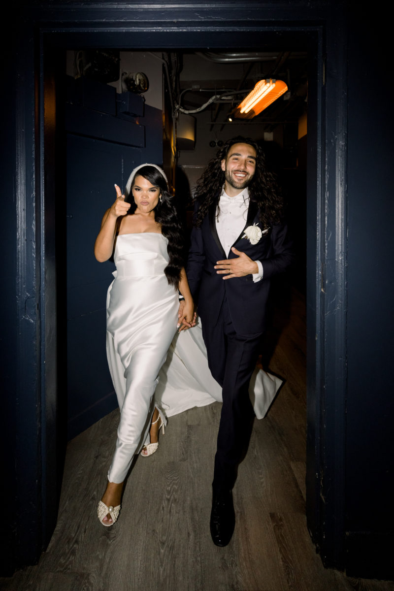 bride and groom walking after getting married the bar and lounge and event space the skylark nyc in midtown manhattan